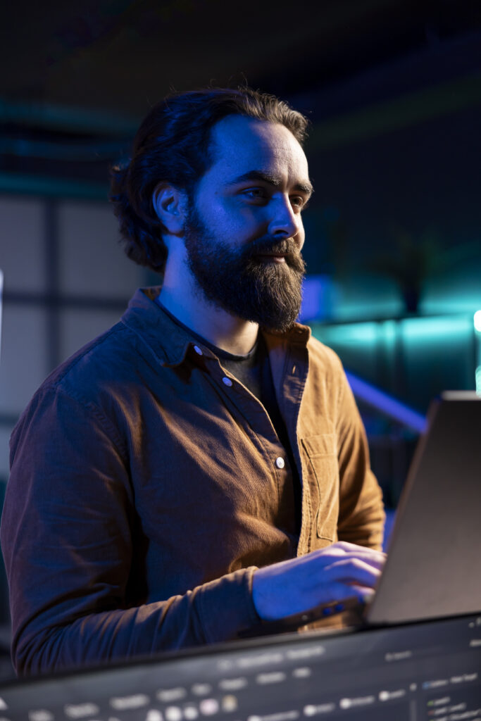 Upbeat IT expert pleased after increasing data security using laptop